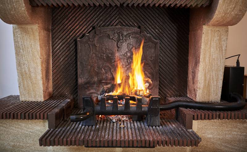The EQUATAIR heat recovery unit in a traditional fireplace