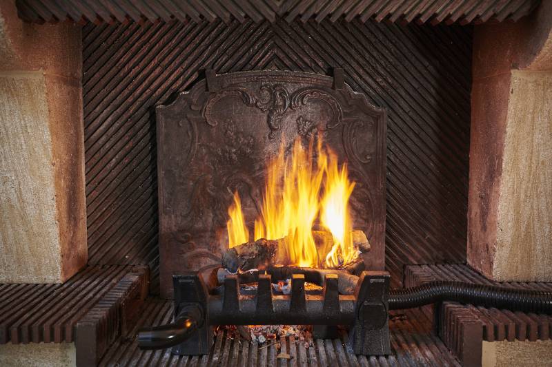 The EQUATAIR heat recovery unit in a traditional fireplace