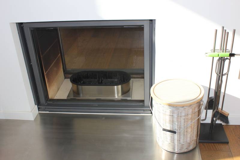 QAITO Q50 empty in a large fireplace in Spain