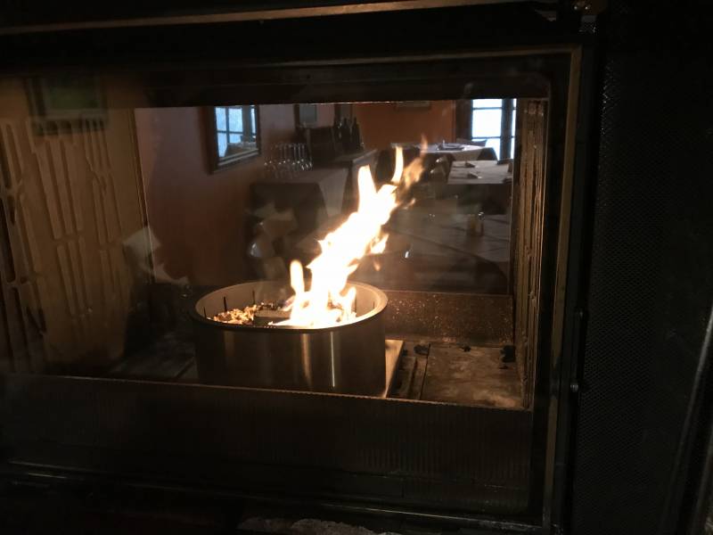 In a double-entry fireplace, QAÏTO is a superior replacement for logs