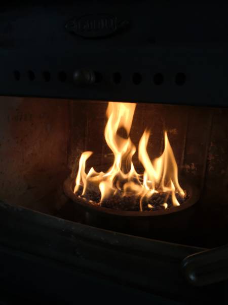 A warm flame in a wood stove