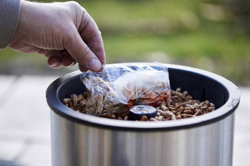 Place the firelighter safely, without burning yourself.